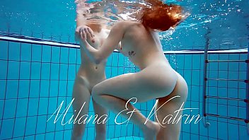 Milana and Katrin strip eachother underwater