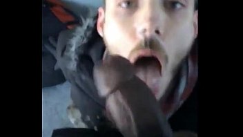 White guy sucking a big fat black cock outside