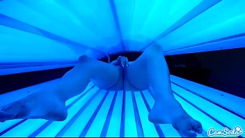 teen latina college student gives  lesbian pussy a massage in tanning bed