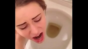 Hot brunette teen slut swallows boyfriends piss over toilet